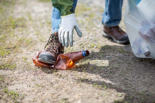 Garden cleanup process with professional equipment in Crouchend